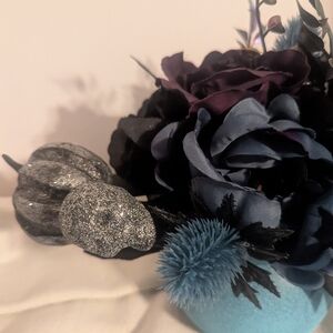 Elegant Floral Arrangement with Blue and Black Accents